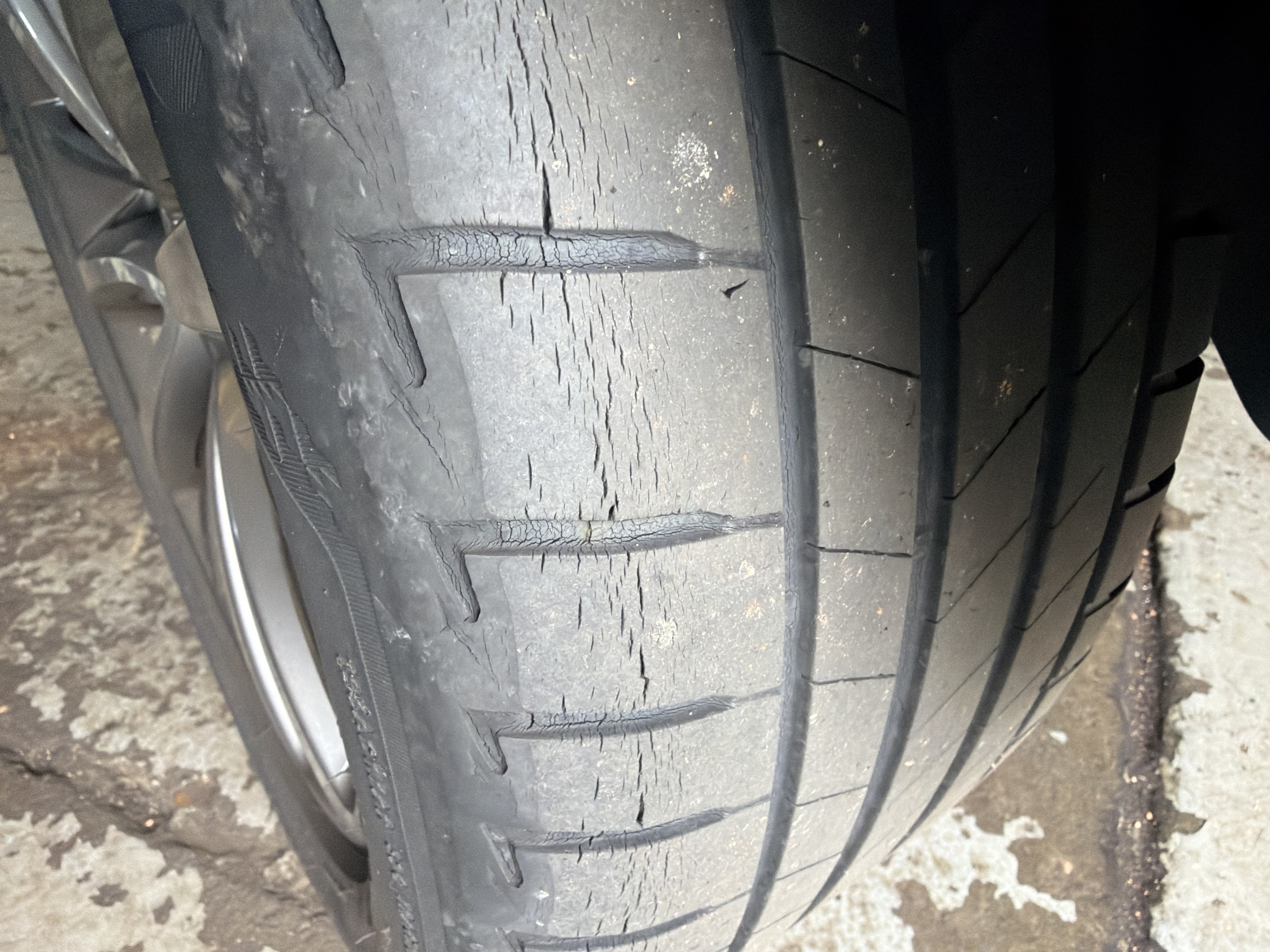 Cracking and perishing visible in an aged tyre