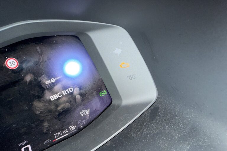 engine-management-light-on-dash Amber engine management light lit on a modern digital instrument cluster