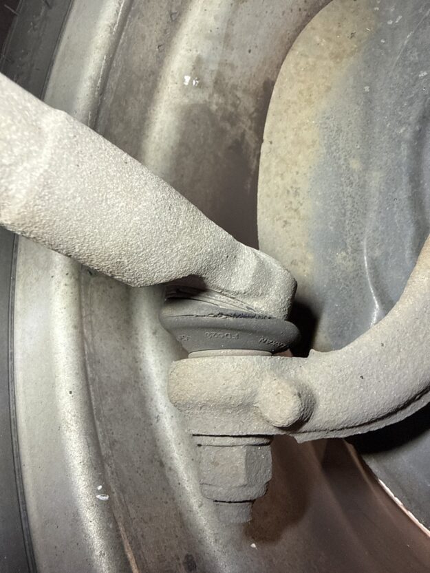 Track rod end ball joint with a ring of cracking around its rubber dust cover