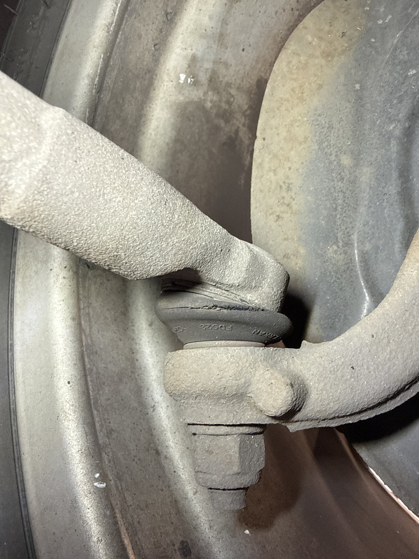 Track rod end ball joint with a ring of cracking around its rubber dust cover