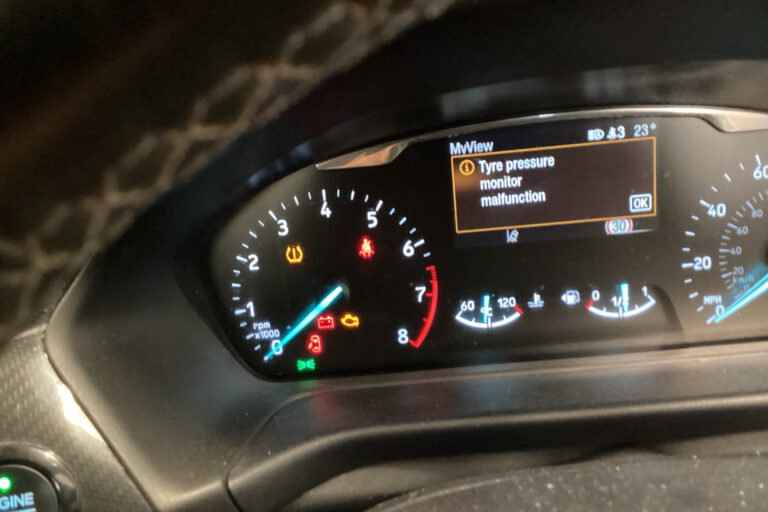 tyre-pressure-monitor-malfunction-message-mot-failure.jpg Ford instrument cluster showing a tyre pressure monitor malfunction message and the amber TPMS warning light