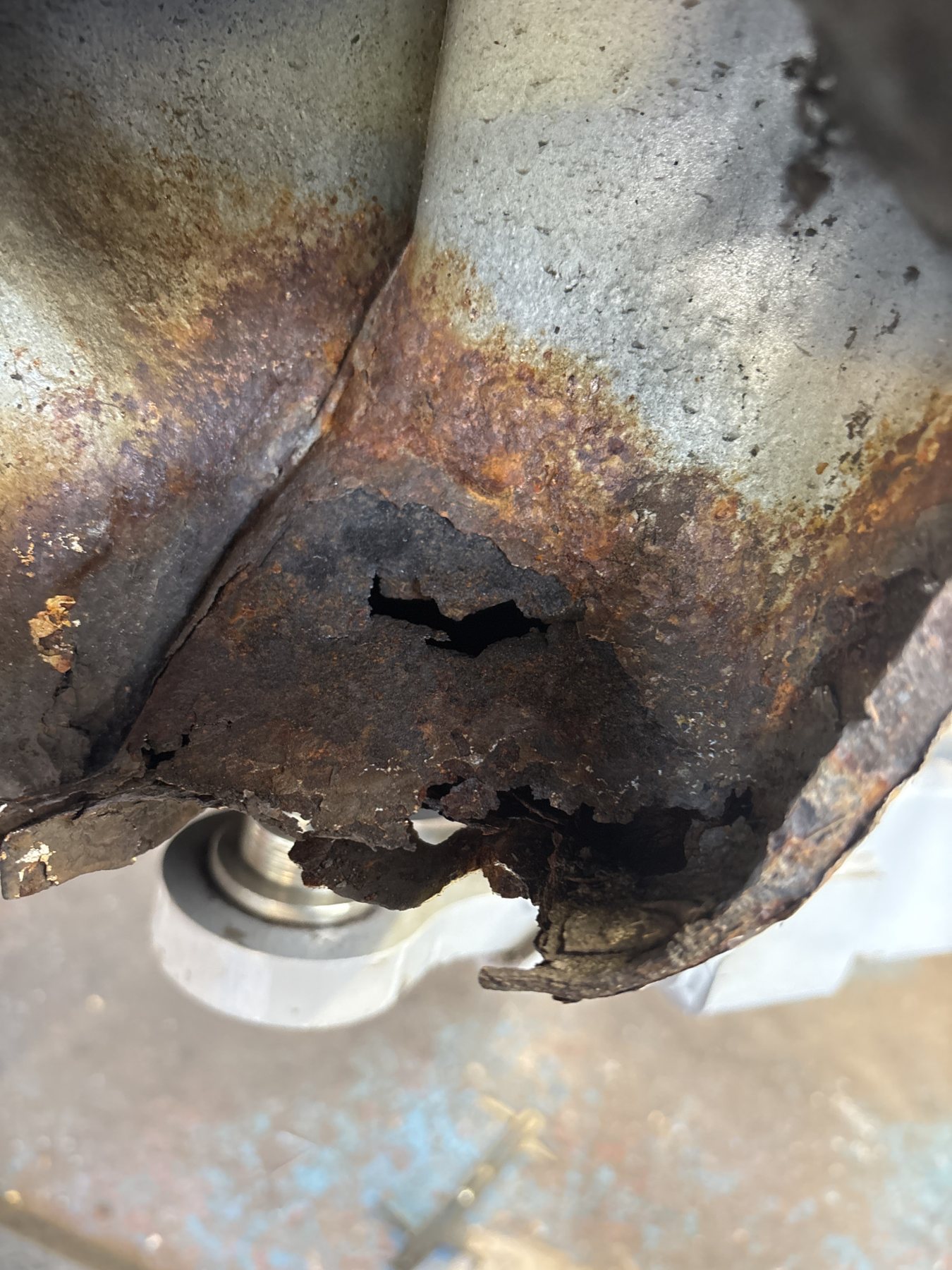 Underside of a sill rotted through and breaking away